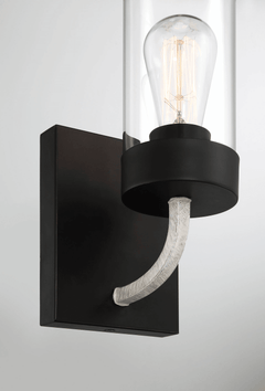 Aplique Zephyr de una luz con cristal transparente y acabado en metal negro